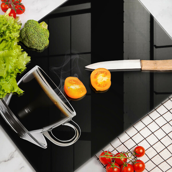 Tagliere in vetro Un bicchiere di caffè caldo