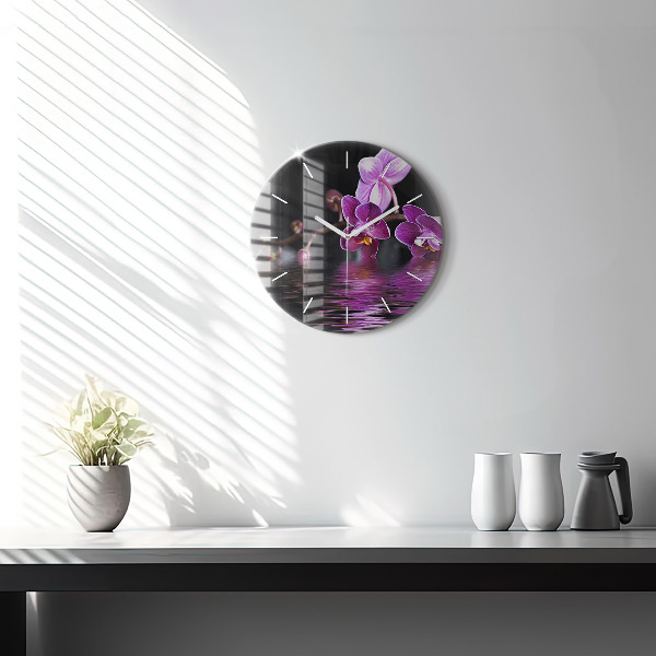 Orologio rotondo Fiore di orchidea sull'acqua