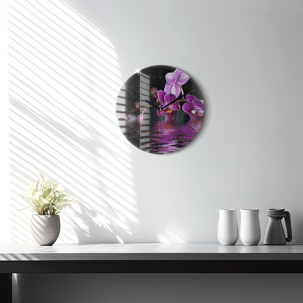 Orologio rotondo Fiore di orchidea sull'acqua