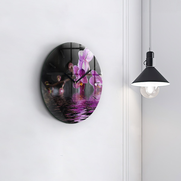 Orologio rotondo Fiore di orchidea sull'acqua
