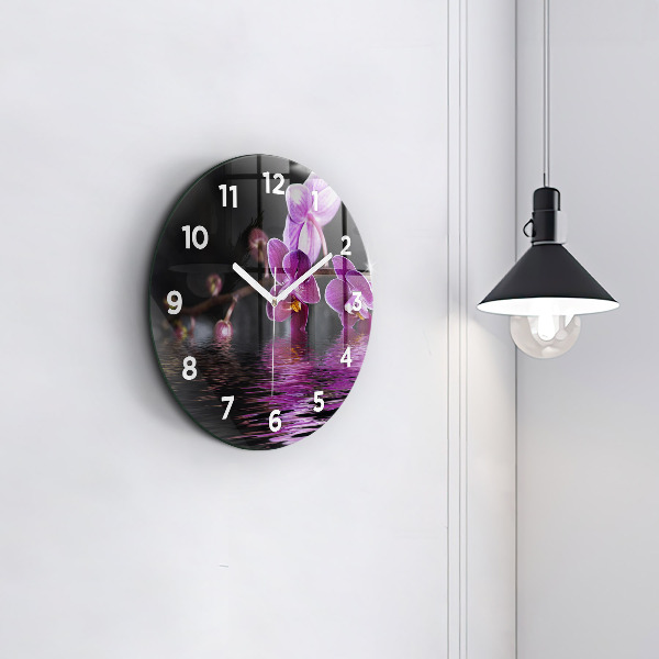 Orologio rotondo Fiore di orchidea sull'acqua