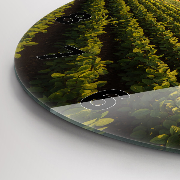 Orologio rotondo in vetro Trattore in un campo agricolo